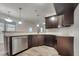 Modern kitchen with dark cabinets and granite countertops at 39 Polenta Flds Dr, Smithfield, NC 27577