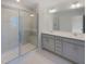 Bathroom boasts double vanity, large mirror, and walk-in shower at 402 Thompson Overlook Way # 252, Smithfield, NC 27577