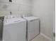 Bright laundry room with washer and dryer included at 402 Thompson Overlook Way, Smithfield, NC 27577