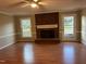 Spacious living room with fireplace and hardwood floors at 427 Overman Drive Dr, Burlington, NC 27215