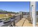 Private deck with seating area overlooking a community and under construction homes at 1507 Village Hall Ln # 35, Wake Forest, NC 27587