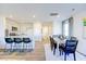 Bright dining area with hardwood floors and stylish table and chairs at 513 Fife Ct, Gibsonville, NC 27249