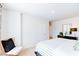 Main bedroom with a striped comforter and large windows at 513 Fife Ct, Gibsonville, NC 27249