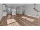 Open living room with hardwood floors and kitchen views at 533 Bistre Dr, Cary, NC 27519