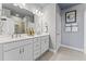 Elegant bathroom boasts double sinks, a large mirror, and a walk-in shower at 600 Market Grove Dr # 100, Wake Forest, NC 27587