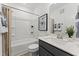 Main bathroom with tub shower, vanity, and neutral decor at 604 Market Grove Dr # 100, Wake Forest, NC 27587