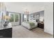 Bright and airy bedroom with a comfortable bed and ample natural light at 604 Market Grove Dr # 100, Wake Forest, NC 27587