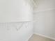 Walk-in closet with wire shelving and hanging rods at 604 Market Grove Dr # 100, Wake Forest, NC 27587