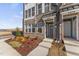 Modern brick townhome with landscaping and a welcoming front entrance at 604 Market Grove Dr # 100, Wake Forest, NC 27587