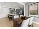 Modern kitchen with gray cabinets, stainless steel appliances, and a large island at 604 Market Grove Dr # 100, Wake Forest, NC 27587