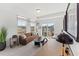 Bright living room with cozy seating and access to balcony at 604 Market Grove Dr # 100, Wake Forest, NC 27587
