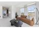 Spacious living area with large windows and comfortable couch at 604 Market Grove Dr # 100, Wake Forest, NC 27587