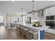 Modern kitchen with island, stainless steel appliances, and white cabinetry at 606 Market Grove Dr # 200, Wake Forest, NC 27587