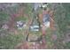 An aerial view showcasing a home nestled within a wooded lot at 624 Great Pine Way, Raleigh, NC 27614