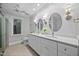 Bathroom featuring double vanity, white cabinets, and modern light fixtures at 624 Great Pine Way, Raleigh, NC 27614