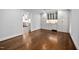 Dining room with hardwood floors, and built in cabinetry with glass doors and under cabinet lighting at 624 Great Pine Way, Raleigh, NC 27614