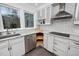 Kitchen corner showcasing white cabinetry, stainless steel appliances, and a convenient rotating shelf at 624 Great Pine Way, Raleigh, NC 27614