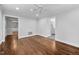 Living room with hardwood floors and openings to other rooms at 624 Great Pine Way, Raleigh, NC 27614