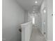 Bright hallway with carpeted floors and neutral walls at 6417 Truxton Ln, Raleigh, NC 27616