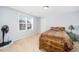 Charming bedroom with a full-size bed and natural light at 78 N Porcenna Ln, Clayton, NC 27527