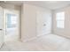 Bright bedroom with double door closet and window at 1001 Rose Finch Dr, Durham, NC 27703