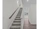 Staircase with carpeted steps and wooden handrail at 109 N Keatts Winner Ct, Clayton, NC 27520