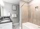 Modern bathroom with double vanity and updated bathtub at 13001 Norwood Rd, Raleigh, NC 27613