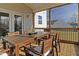 Relaxing screened porch with wood deck and dining furniture at 1318 Reading Ct, Burlington, NC 27217