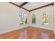 Bright office with hardwood floors, arched windows, and high ceilings at 15 Treviso Pl, Durham, NC 27707