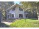 White two-story house with a side view showcasing its windows and landscaping at 1615 Carbonton Rd, Sanford, NC 27330