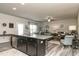 Kitchen with island, stainless steel appliances and view into living room at 170 Vega Loop, Sanford, NC 27330