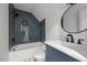 Modern bathroom with blue tile and a white vanity at 1811 Bellemont Alamance Rd, Burlington, NC 27215