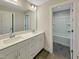 Double vanity bathroom with large mirror and shower at 203 Pond Vw Ct # 1, Fuquay Varina, NC 27526