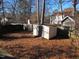 Spacious backyard with storage shed, wooden fence and trees at 204 Willoughby Ln, Cary, NC 27513