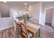 Elegant dining room with a wood table and four chairs at 205 Pond Vw Ct # 2, Fuquay Varina, NC 27526