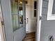 Gray front door with glass panels and modern hardware at 209 Pond View Ct # 4, Fuquay Varina, NC 27526