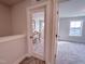 Hallway view of bedroom and office with glass doors at 209 Pond View Ct # 4, Fuquay Varina, NC 27526