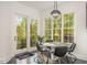 Breakfast nook with a round table and chairs, offering a view of the backyard at 25303 Ludwell, Chapel Hill, NC 27517