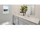 Modern bathroom with dual sinks and a quartz countertop at 255 Moore Creek Dr, Fuquay Varina, NC 27526