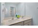 Double vanity bathroom with light blue walls and a large mirror at 255 Moore Creek Dr, Fuquay Varina, NC 27526