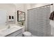 Clean bathroom with shower/tub combo and striped shower curtain at 255 Moore Creek Dr, Fuquay Varina, NC 27526