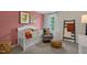 Bright Bedroom with crib, armchair, and window at 255 Moore Creek Dr, Fuquay Varina, NC 27526