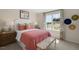 Charming bedroom with coral bedding and white accent wall at 255 Moore Creek Dr, Fuquay Varina, NC 27526