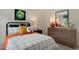 Bright bedroom with a full-size bed, dresser, and décor at 255 Moore Creek Dr, Fuquay Varina, NC 27526