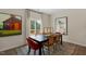 Bright dining area with hardwood floors and access to deck at 255 Moore Creek Dr, Fuquay Varina, NC 27526