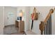 Bright entryway with console table, rug, and stairway at 255 Moore Creek Dr, Fuquay Varina, NC 27526