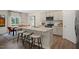 Modern kitchen with granite countertops, island, and stainless steel appliances at 255 Moore Creek Dr, Fuquay Varina, NC 27526