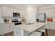 Modern kitchen with stainless steel appliances and granite countertops at 255 Moore Creek Dr, Fuquay Varina, NC 27526