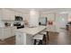 Modern kitchen with island, stainless steel appliances, and granite countertops at 255 Moore Creek Dr, Fuquay Varina, NC 27526