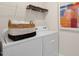 Laundry room with washer, dryer, and shelving at 255 Moore Creek Dr, Fuquay Varina, NC 27526
